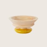Tour de table en bois jaune de chez Alessi